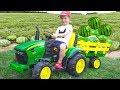 Darius rides on tractor  kids pretend play riding on truck toys gathering watermelon