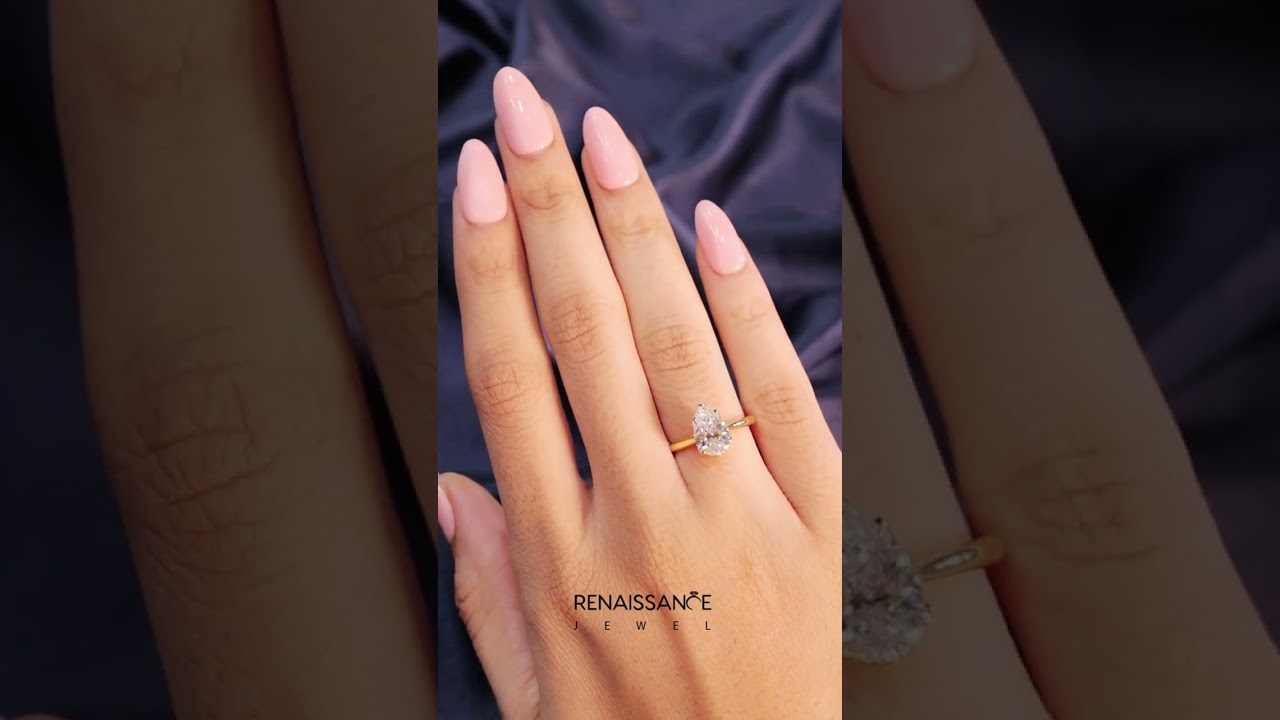 Yellow gold Pear-Shaped Solitaire Diamond Ring with Knife-Edge Band and Six-Prong Setting