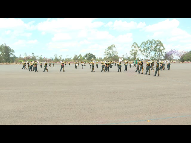 Kenya Prison Band spreads out to form a pattern as they entertain guests class=