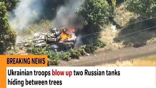 Ukrainian troops blow up two Russian tanks hiding between trees