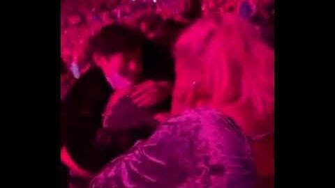 V and Lizzo hugging each other at Harry