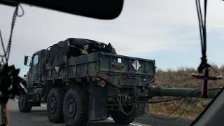 USMC trucks loaded with people!