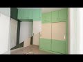 Pista green sliding wardrobe with wall panelling