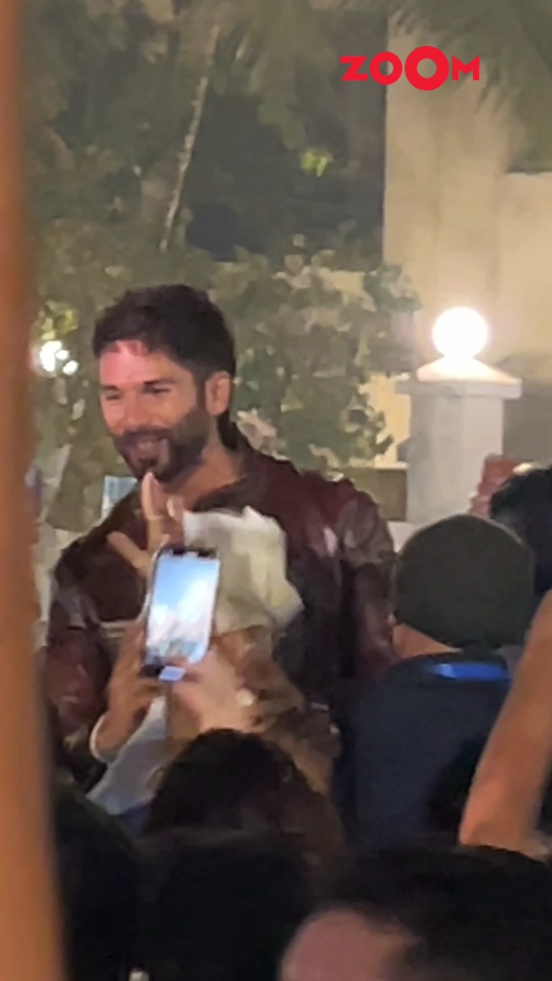CRAZE for Shahid Kapoor is real; actor POSES with fans at the teaser launch of Deva ? #shahidkapoor