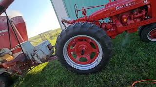 Putting the Farmall M to work, cracking corn.