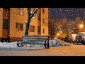 Snowfall in the night city. Snowstorm and wind sounds for background and sleep