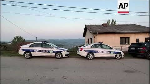 Police in street in Dubona where 8 were fatally shot