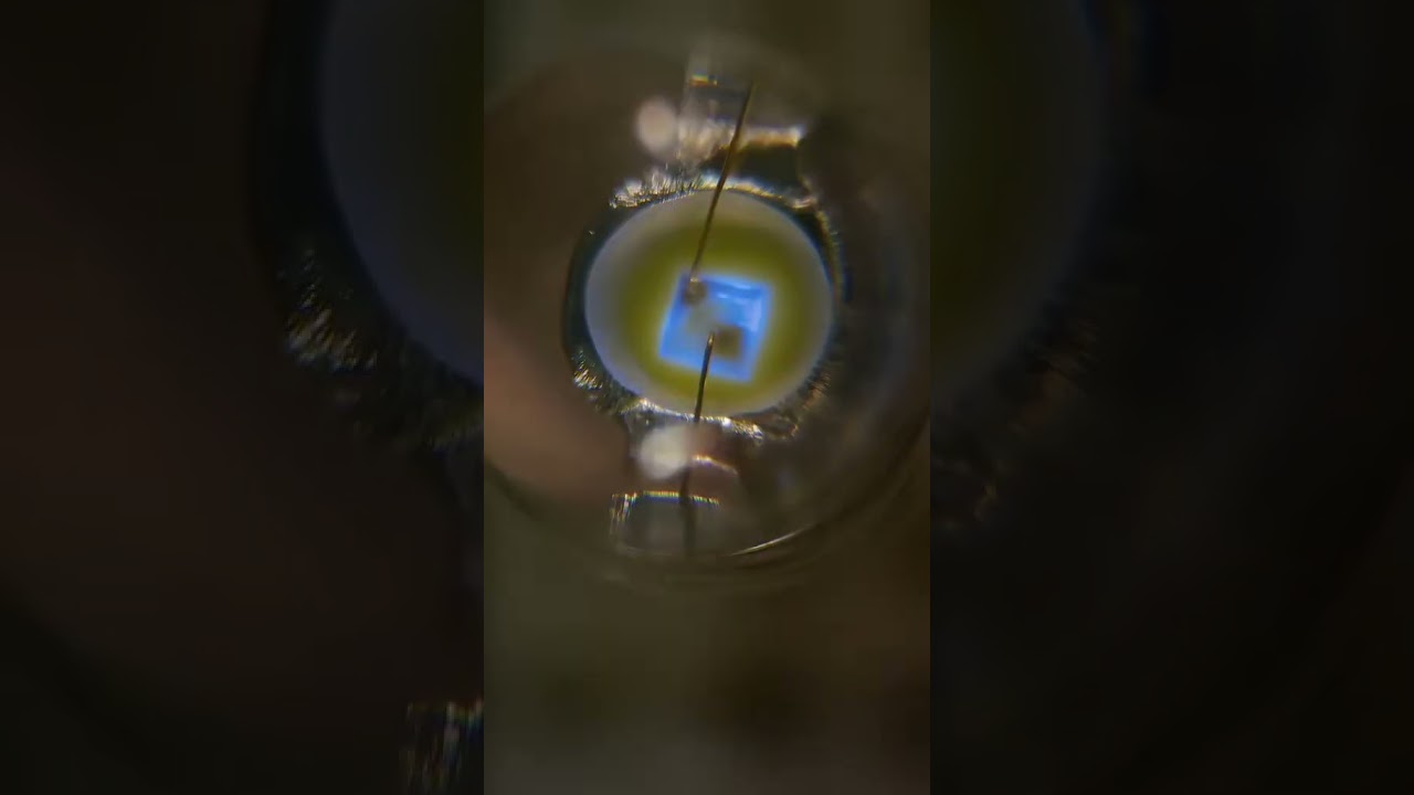 Vintage white LED waking up  under the microscope 