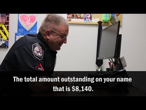 Watch Police Officer Hilariously Play Along With IRS Scammer