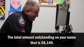 Watch Police Officer Hilariously Play Along With IRS Scammer