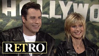 Miniatura de vídeo de "Grease: John Travolta and Olivia Newton-John Reflect on THAT Finale Reveal | rETro"