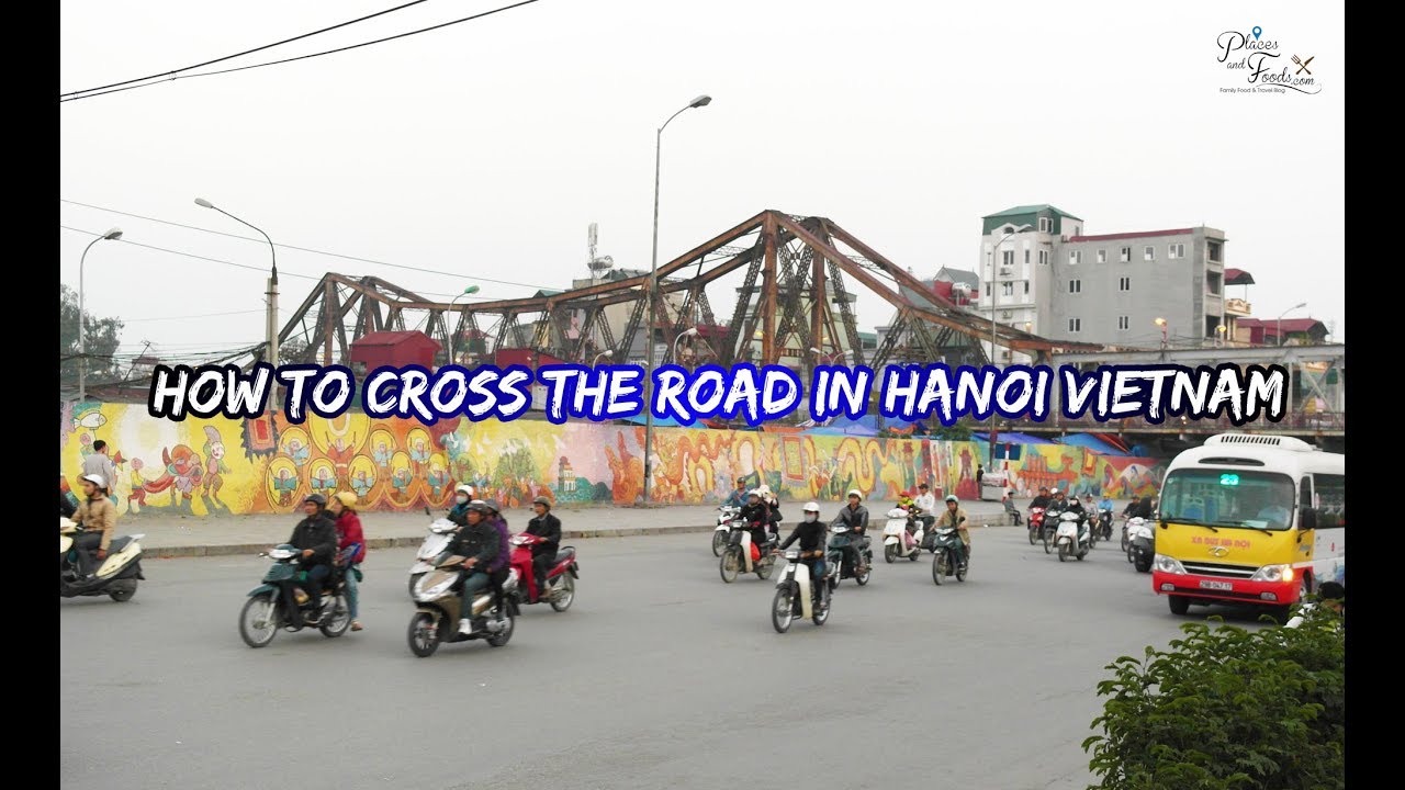 People Crossing Street In The Busy Streets Of Hanoi, Vietnam Stock