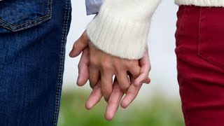 What It Means When You Hold Hands With INTERLOCKING FINGERS