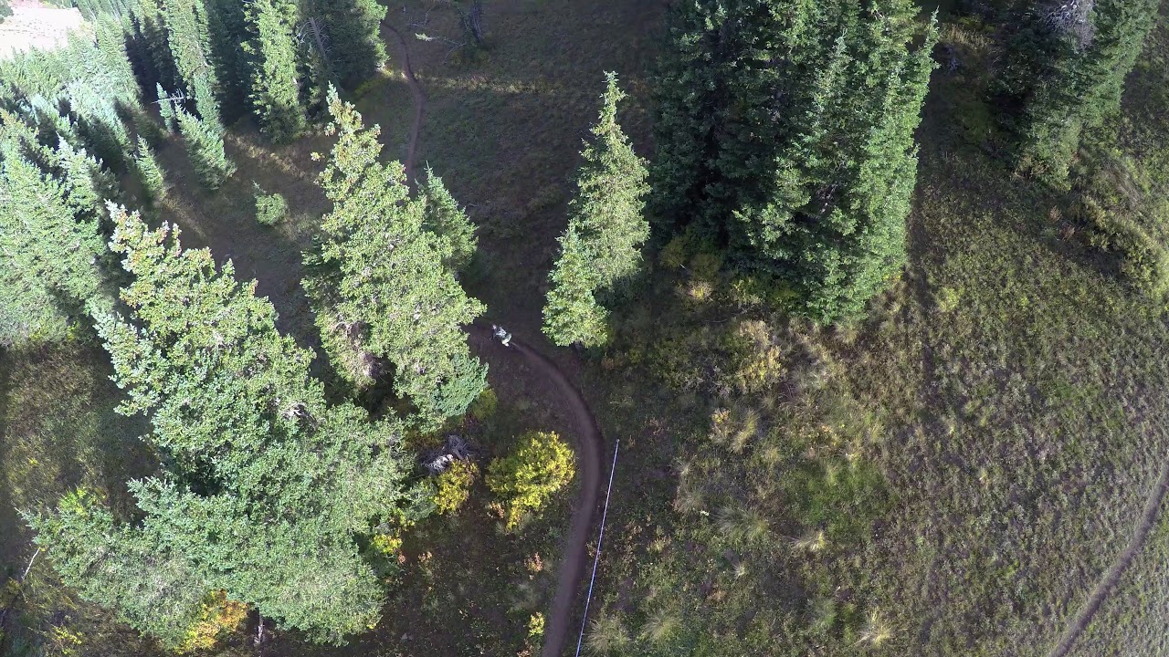 Becky pedaling out the front door of Talking Mountain Yurt to the Whole Enchilada
