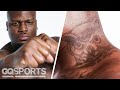 UFC Fighter Derrick Lewis Breaks Down His Tattoos | GQ Sports