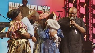 Mercy Chinwo & Husband Dedicate Their First Son Live At Her Overwhelming Victory Concert In Lagos