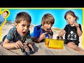 Toy Monster Trucks Find Pretend Play Buried Gold at the Beach