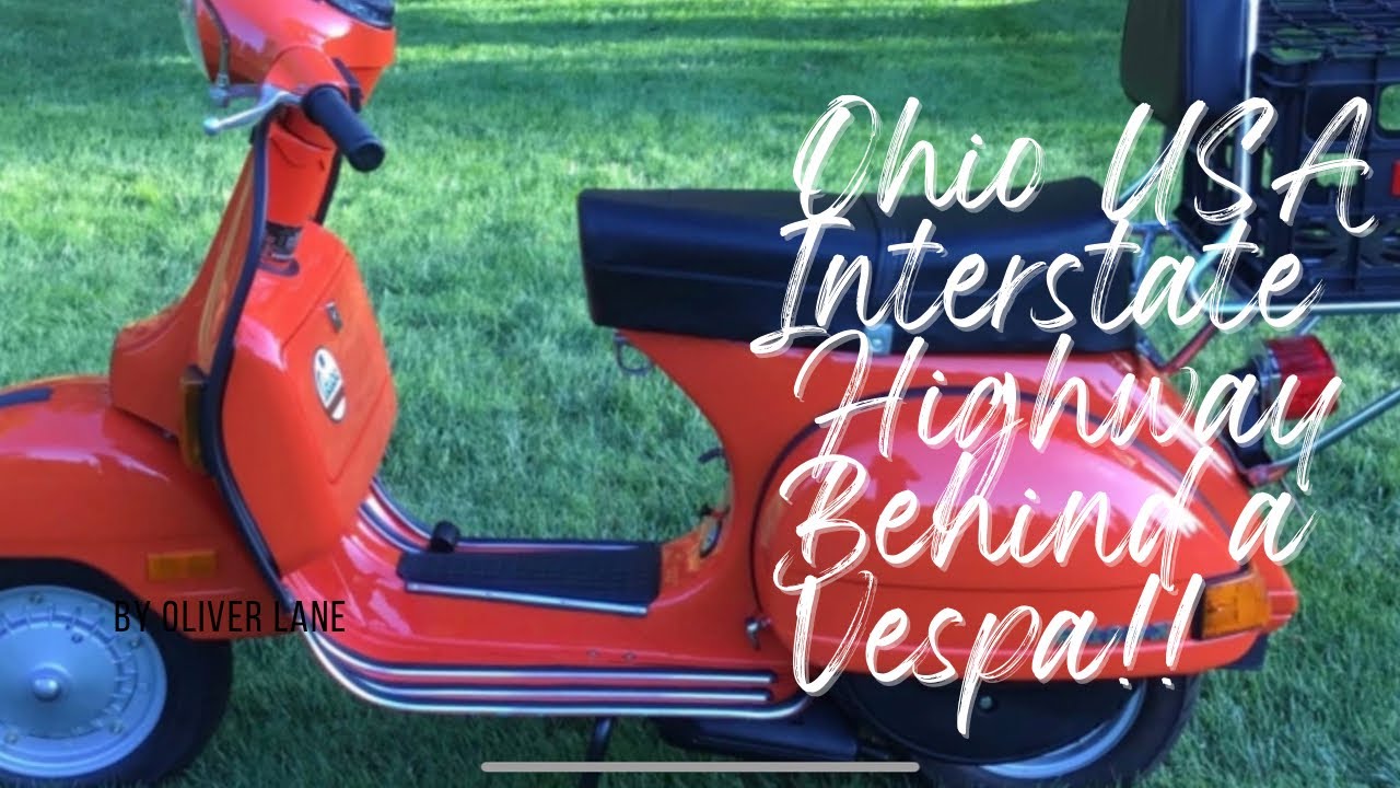 Following an Orange Vintage Vespa Scooter on the Interstate Highway in