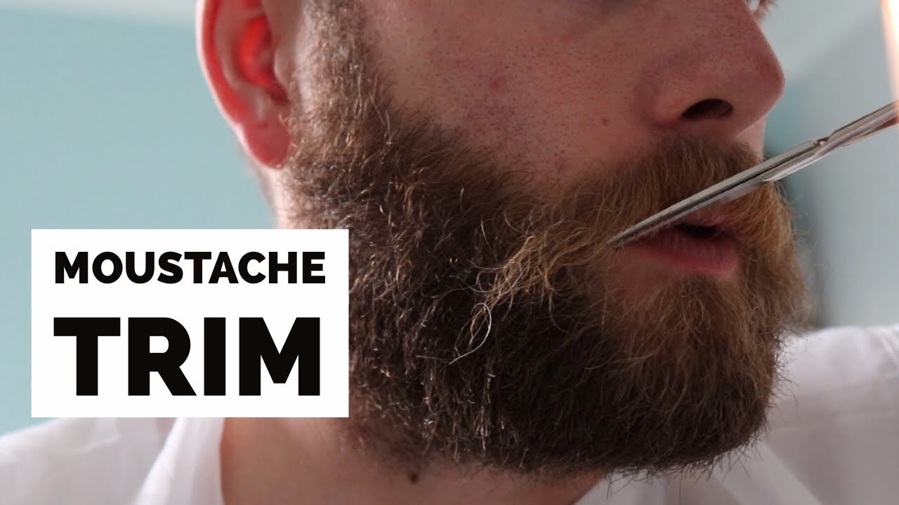 trimming mustache with beard trimmer
