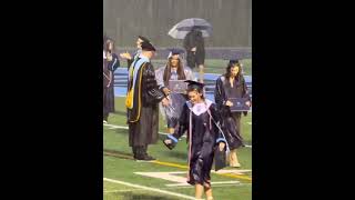 Centennial High School in Franklin, TN held graduation on the football field in heavy pouring rain