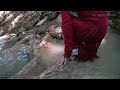 Wetlook - Ingrid in river with red dress and old Converse