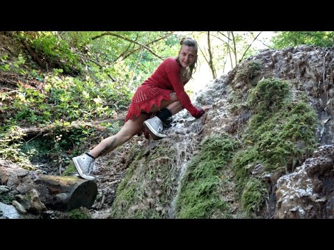 Wetlook - Ingrid in river with red dress and old Converse