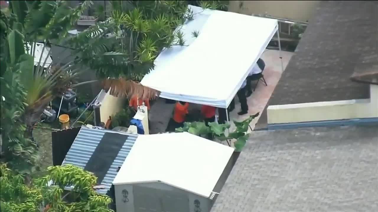 Detectives dig up backyard for second day in missing person case - YouTube