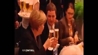 Waiter Spills Beer on German Leader Angela Merkel