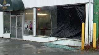 Wind shatters window at Watertown business