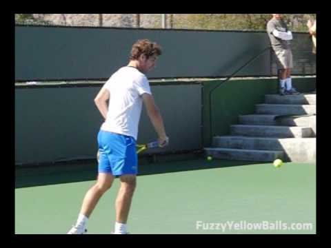 www.fuzzyyellowballs.com Richard Gasquet hitting one-handed topspin backhands in slow motion. This video was filmed during a practice session at the 2009 BNP Paribas Open in Indian Wells, CA ( www.bnpparibasopen.org ). To learn how to hit one-handed topspin backhands like Gasquet and for more slow-motion video, visit http !