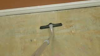 Removing dirt and fine dust from concrete floor..Before scrubbing the floor.
