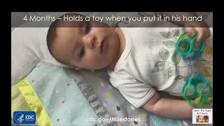 4 Months – Holds a toy when you put it in his hand