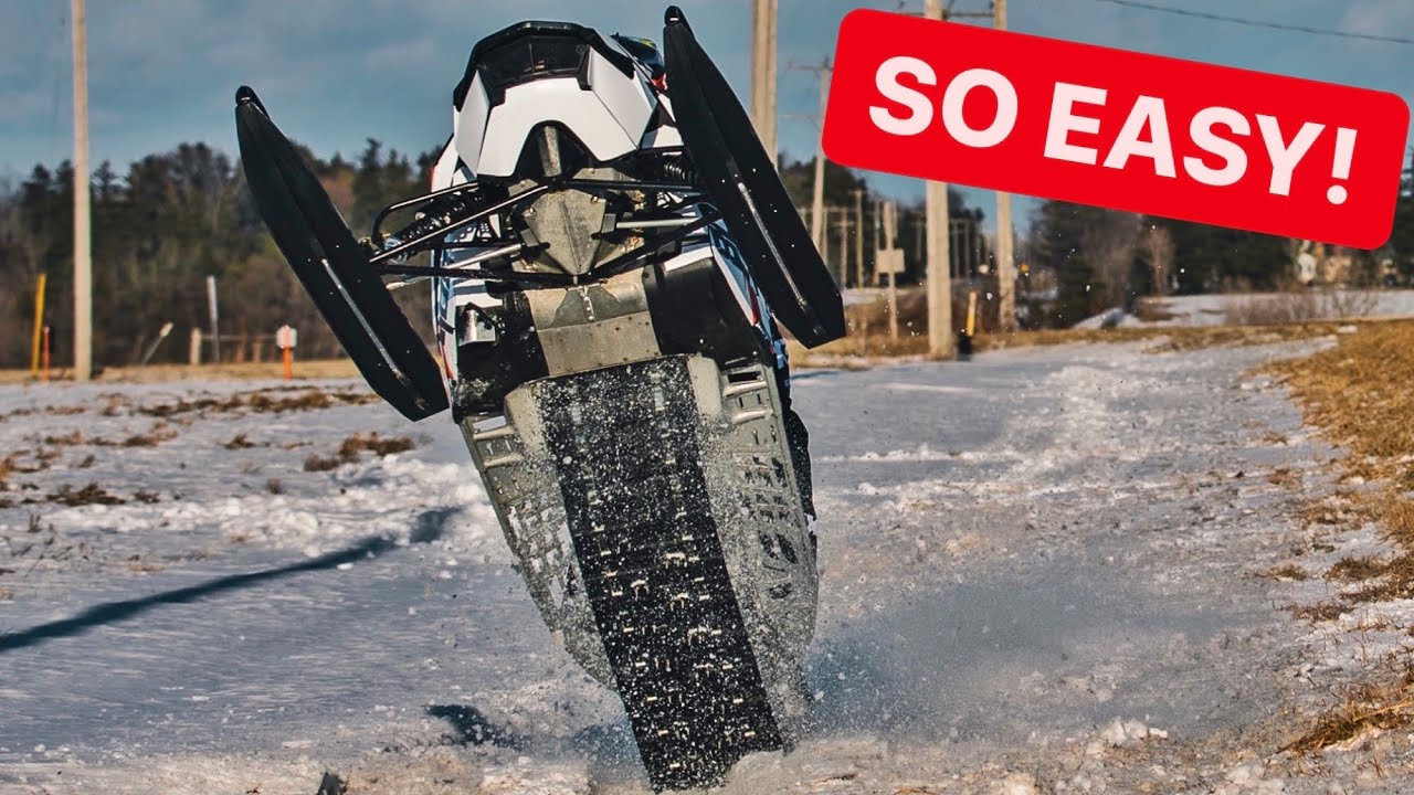 ⁣How To WHEELIE A SNOWMOBILE!