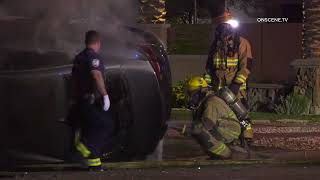 Sedan Bursts Into Flames After Rollover Crash