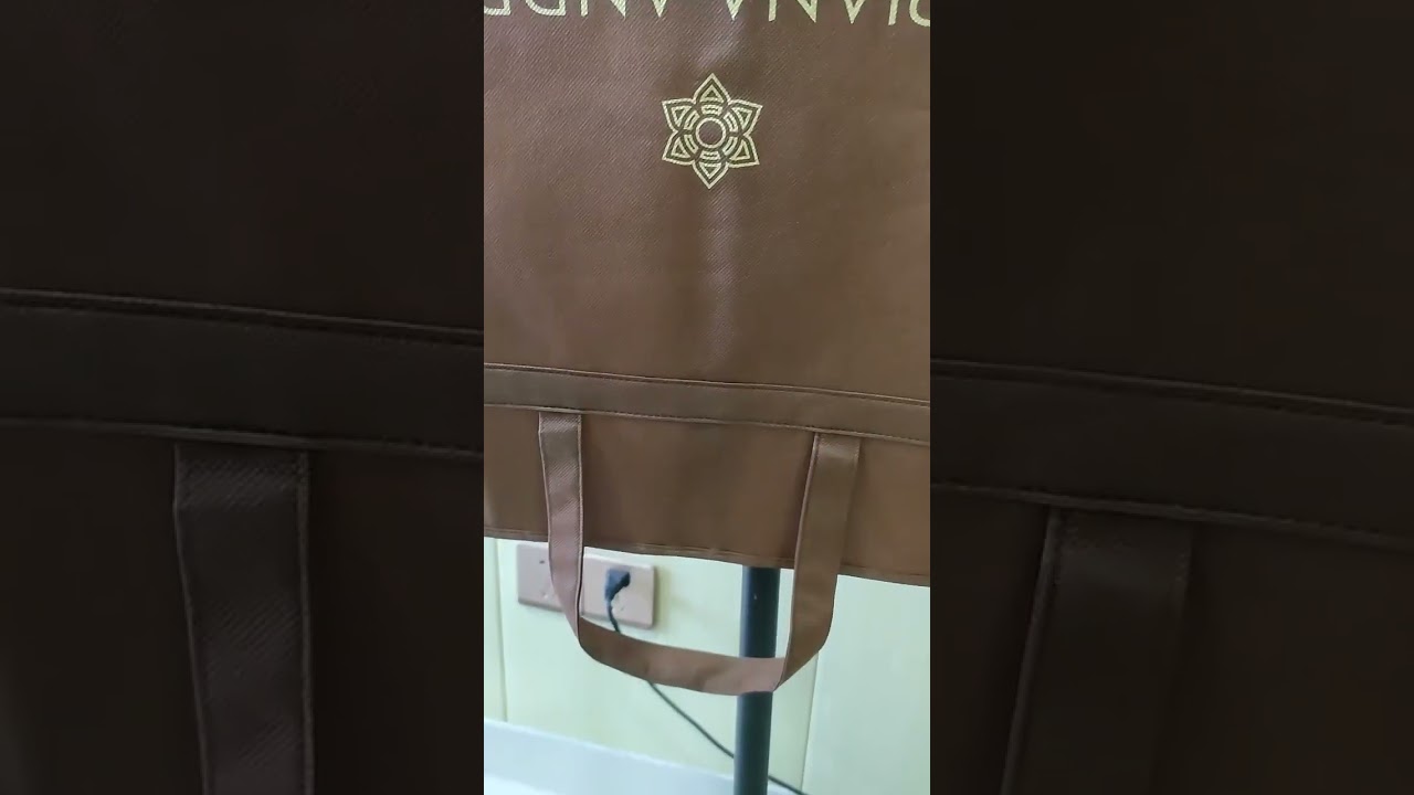 brown non woven suit bag