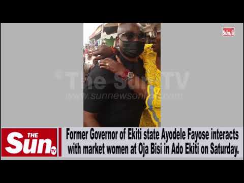 Former Governor of Ekiti state Ayodele Fayose interacts with market women