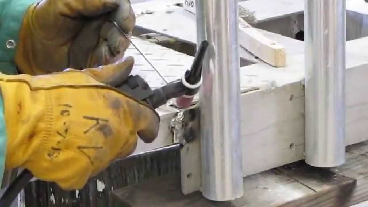 welding a hitch mounted surf fishing rod rack with kenny