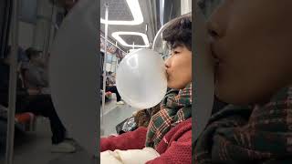 Man Blows Enormous Bubble Gum On Subway Stuns Onlookers In Eastern China