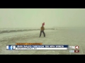 Man walks through 100 mph winds