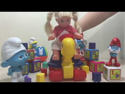 baby-girl---we-collected-the-figures-with-the-smurfs---baby-toys