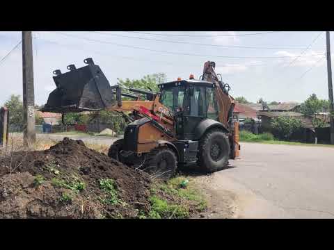 Video: Cât cântărește un buldoexcavator Case?
