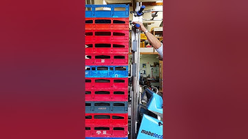 Mobot No.5 unloading bread crates.