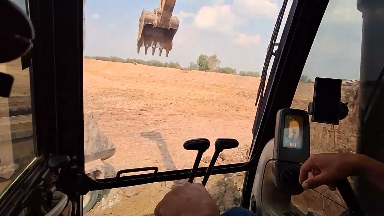 Take a look inside the cab of a CAT 320 GC excavator.