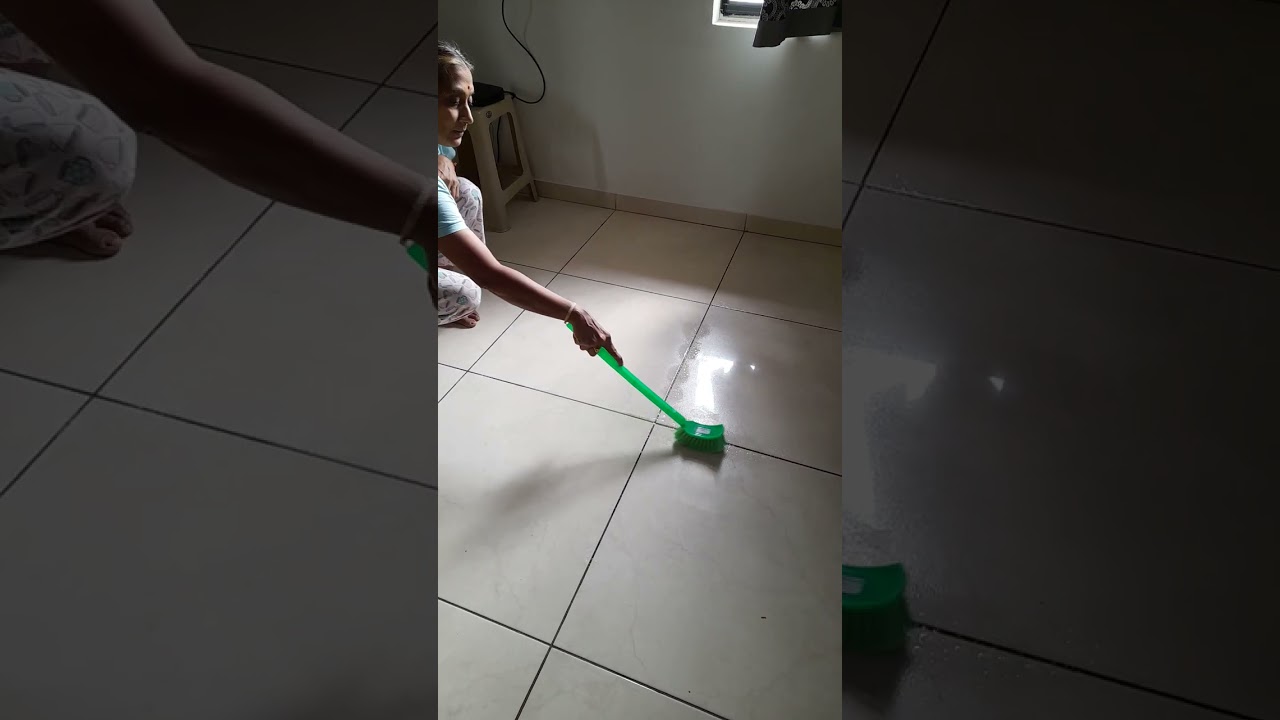 Cleaning the tile dirt.