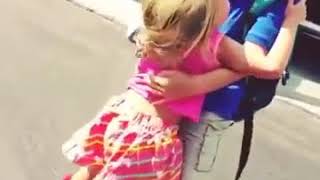 Little sister hugs her big brother every day after school