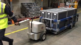 Electric tug pulling an adjustable cart mover trolley | Powered materials handling | Electrodrive