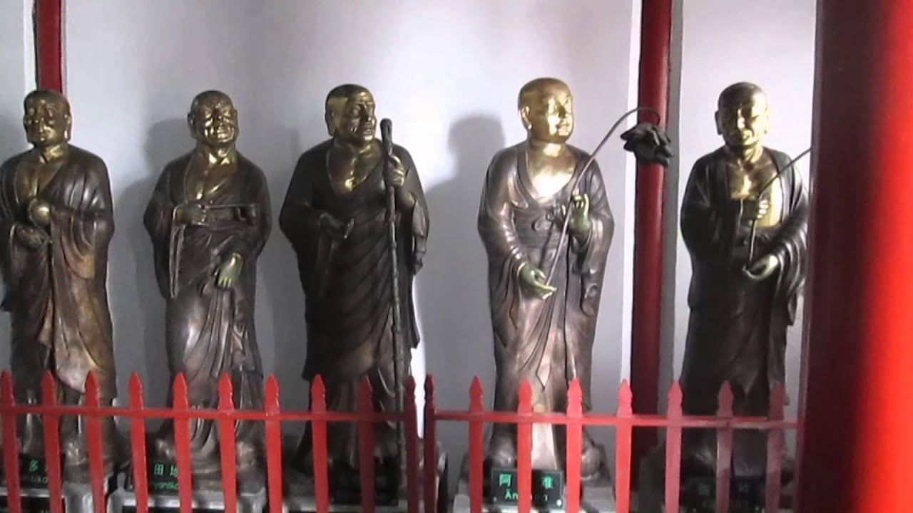 Boat ride down the river at Longmen and visit to Xiangshan Temple