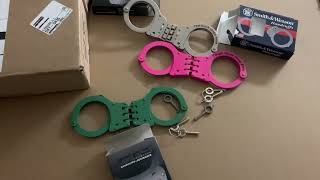 Package unboxing from handcuff warehouse got three new hinged handcuffs.