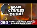 IRAN BREAKING: Watch Dubai US Consulate ERUPT into flames after drone strike as tourists flee