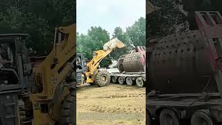 Shifting Massive Loads: How Wheel Loaders Manage Oversized Industrial Machinery Unloading